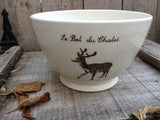 Salad bowl for service with a deer or a moose as a design with french inscription "le bol du chalet