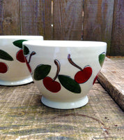 One coffee bowl handmade and hand thrown made of porcelain with cherries pattern