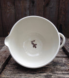Mixing bowl with spout and handle with a deer