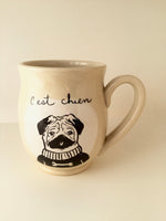 Pug mug " made of hand-turned porcelain clay with a dog design and french inscription "C'est chien" left handed or right handed available