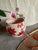 Small crochet or yarn bowl for crochet or knitting with an Red flowers